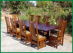 Set of ten chairs around one of our large tables with both end leaves installed.